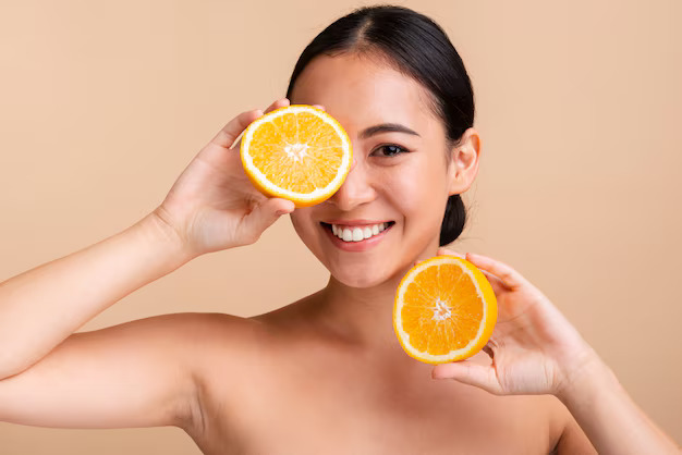 Close-up asian girl with orange