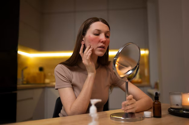 a woman with acne is looking at herself in front of a mirror