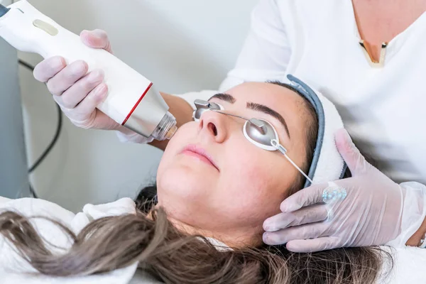 woman microneedling ongoing treatment